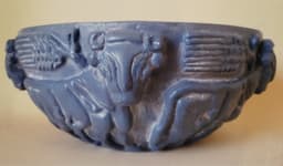 Votive vase of dark-gray steatite on its surface represented figures from Ur